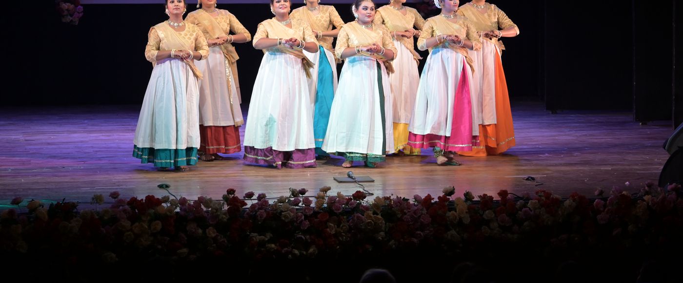 Kathak students performing together on stage