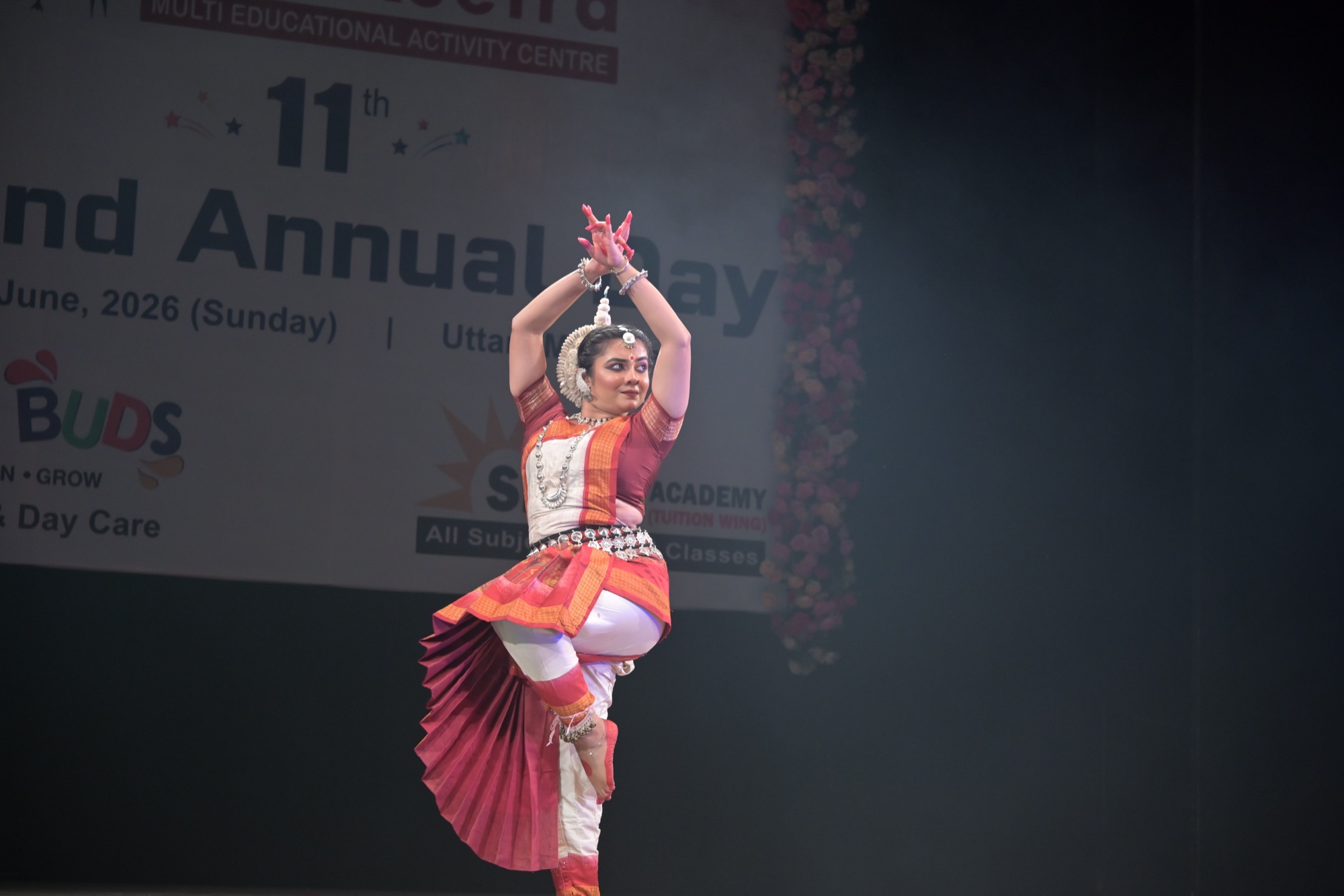 Odissi dancer balanced on one foot in a sculptural pose