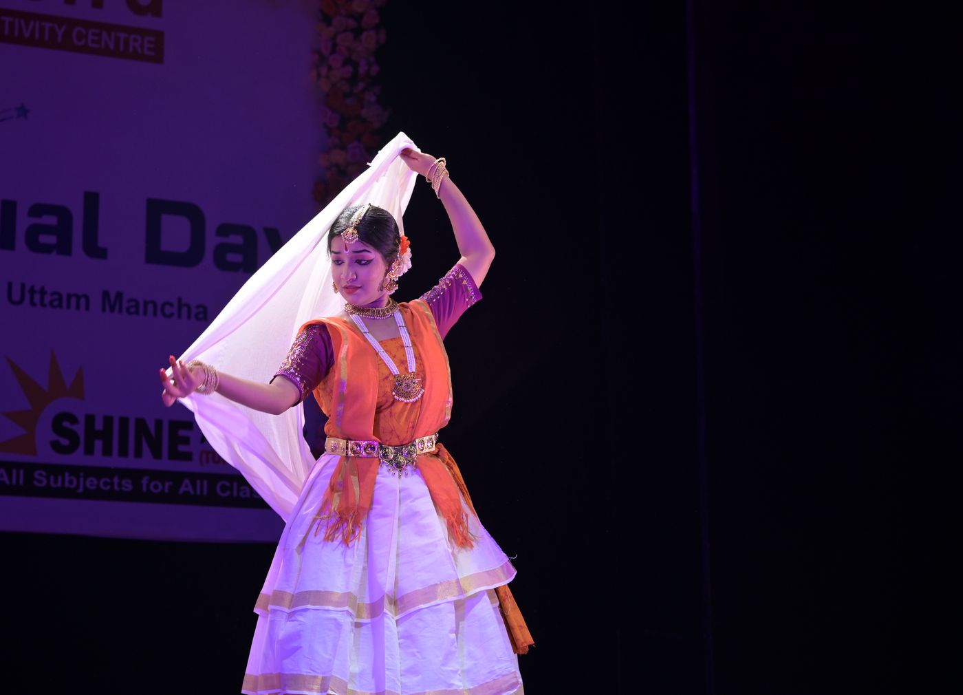 Rabindranritya dancer holding a flowing white scarf overhead