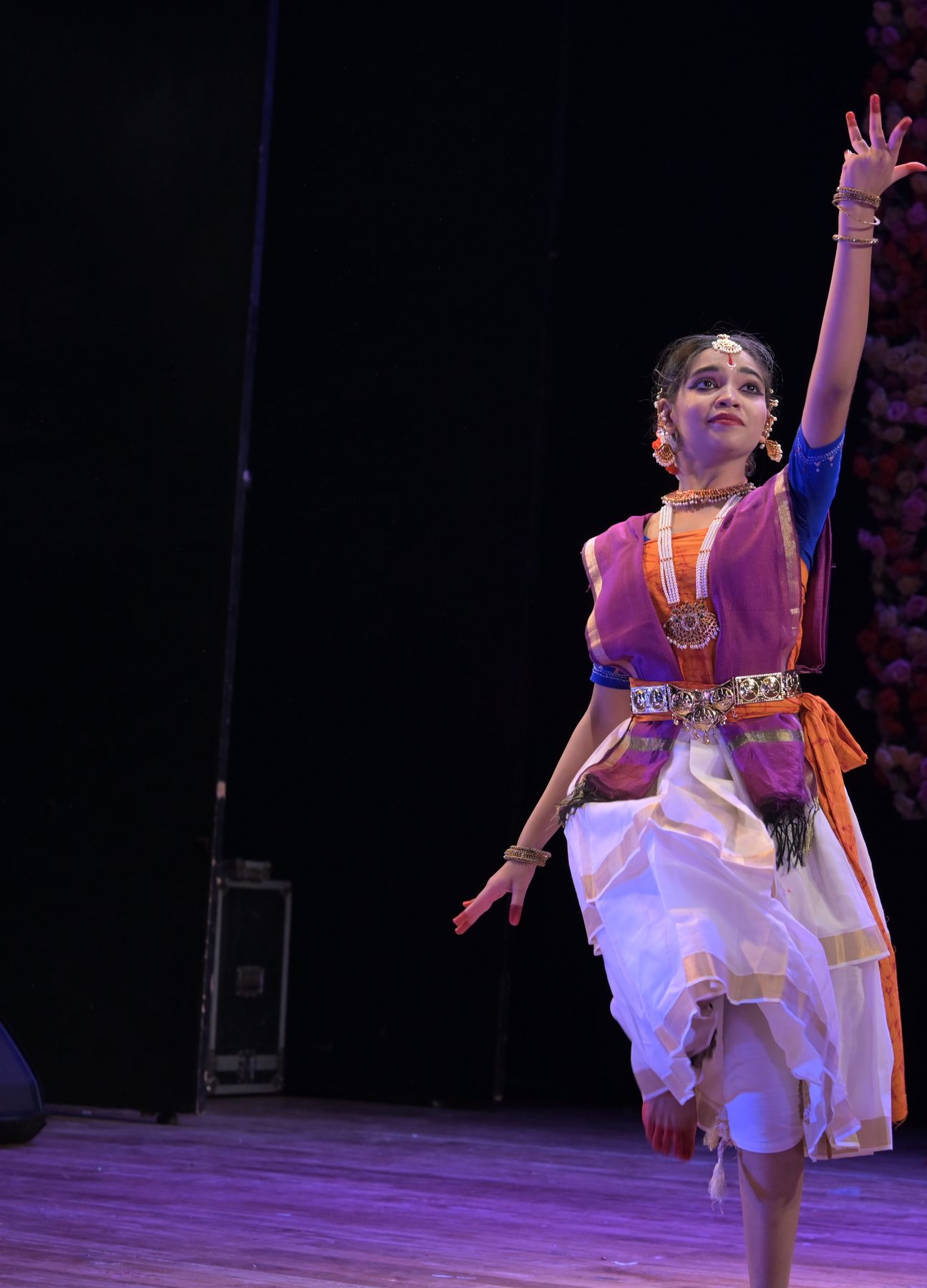 Rabindranritya dancer in a triumphant pose with one arm raised